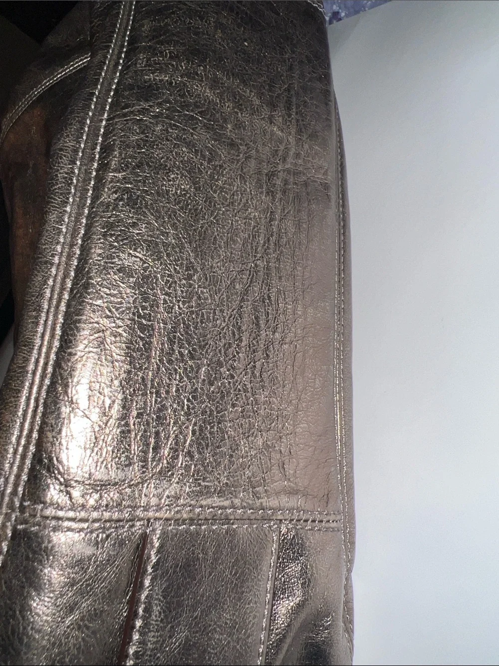 Coach Madison Maggie hobo shoulder bag featuring a metallic gunmetal leather